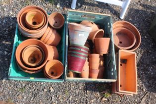 A quantity of various terracotta plant pots, troug