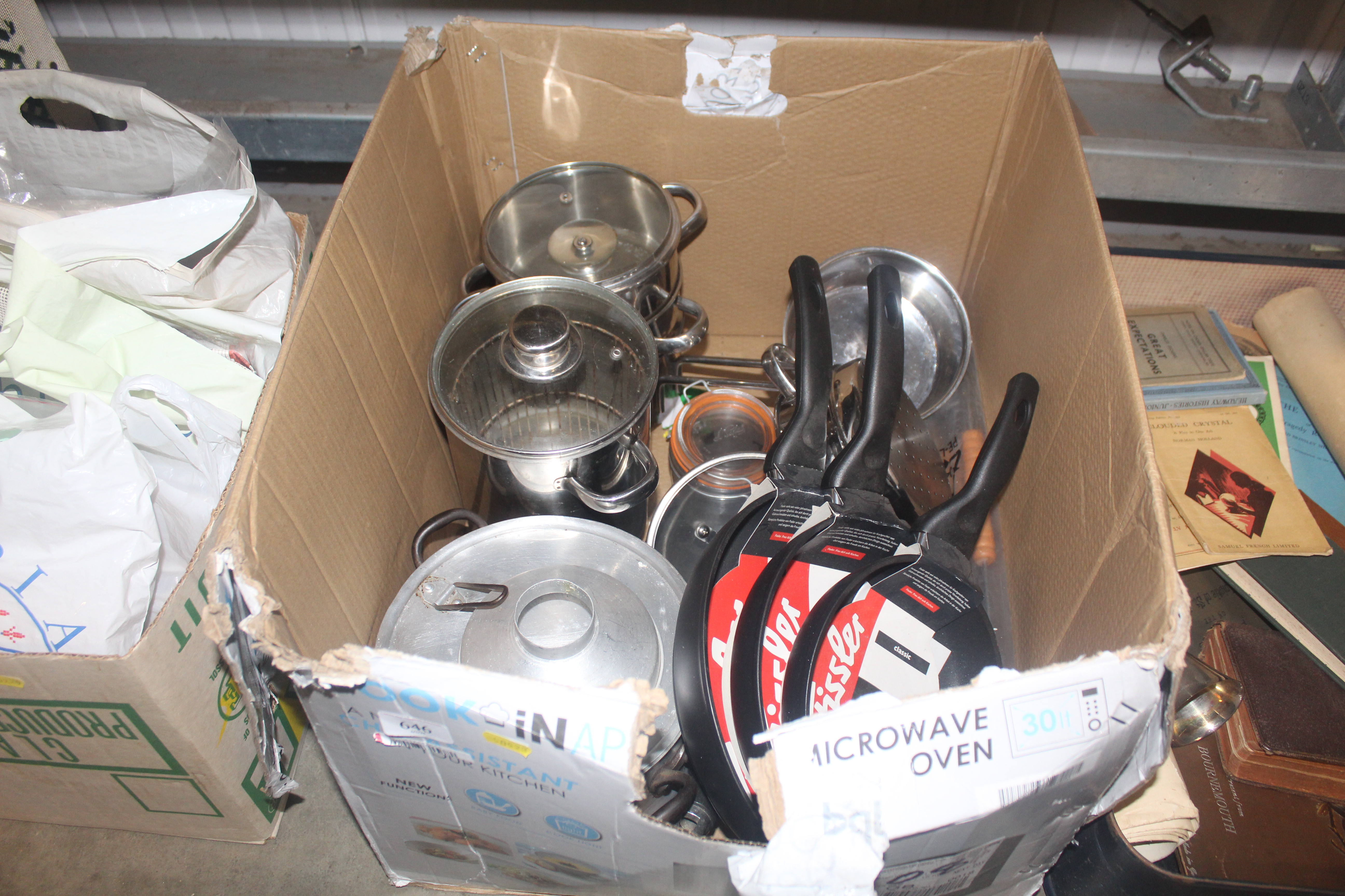 A box of kitchenalia including saucepans