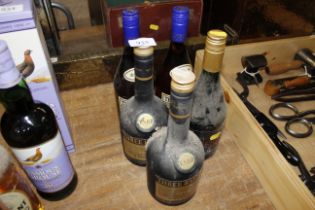 A bottle of French brandy and four bottles of Thre