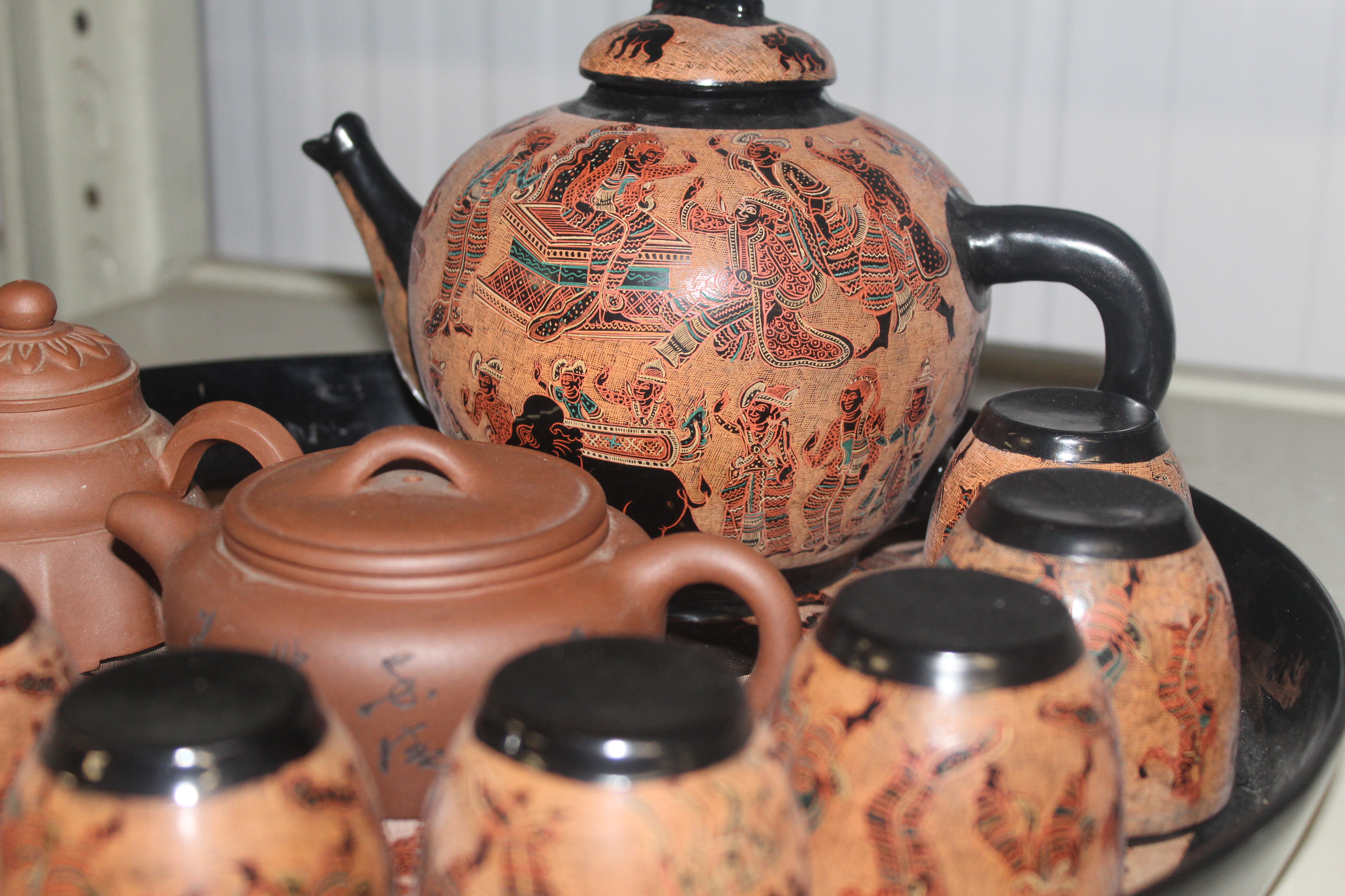 An Oriental lacquered tea set on tray and two terracotta tea pots character marks to base - Image 2 of 2