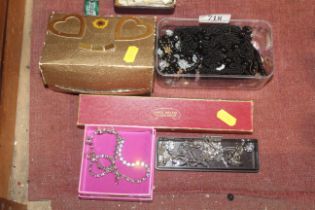 Five boxes containing various costume jewellery
