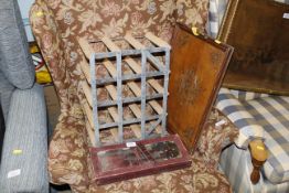 A wine rack, and oak tray and a knife set