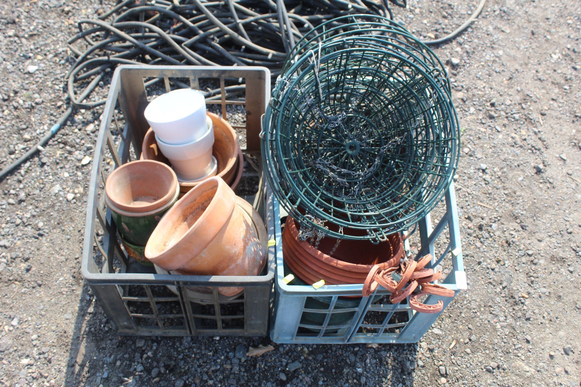 A quantity of metal hanging baskets, plastic plant