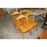 Four pine spindle back kitchen chairs
