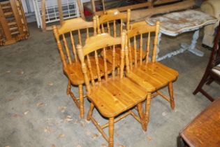 Four pine spindle back kitchen chairs