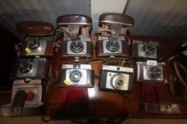 A collection of eight cameras including Alford Spo