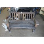 A hardwood two seater garden bench