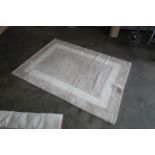 An approx. 6'6" x 4'8" modern rug