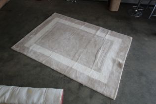An approx. 6'6" x 4'8" modern rug