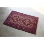 An approx. 4'4" x 2'7" Baluchi rug