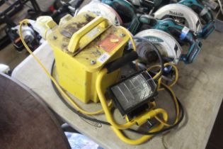 A site transformer and a 110v work lamp