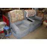 An upholstered reclining two seater settee and matching armchair