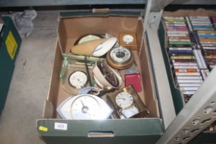 A box of various clocks and barometers