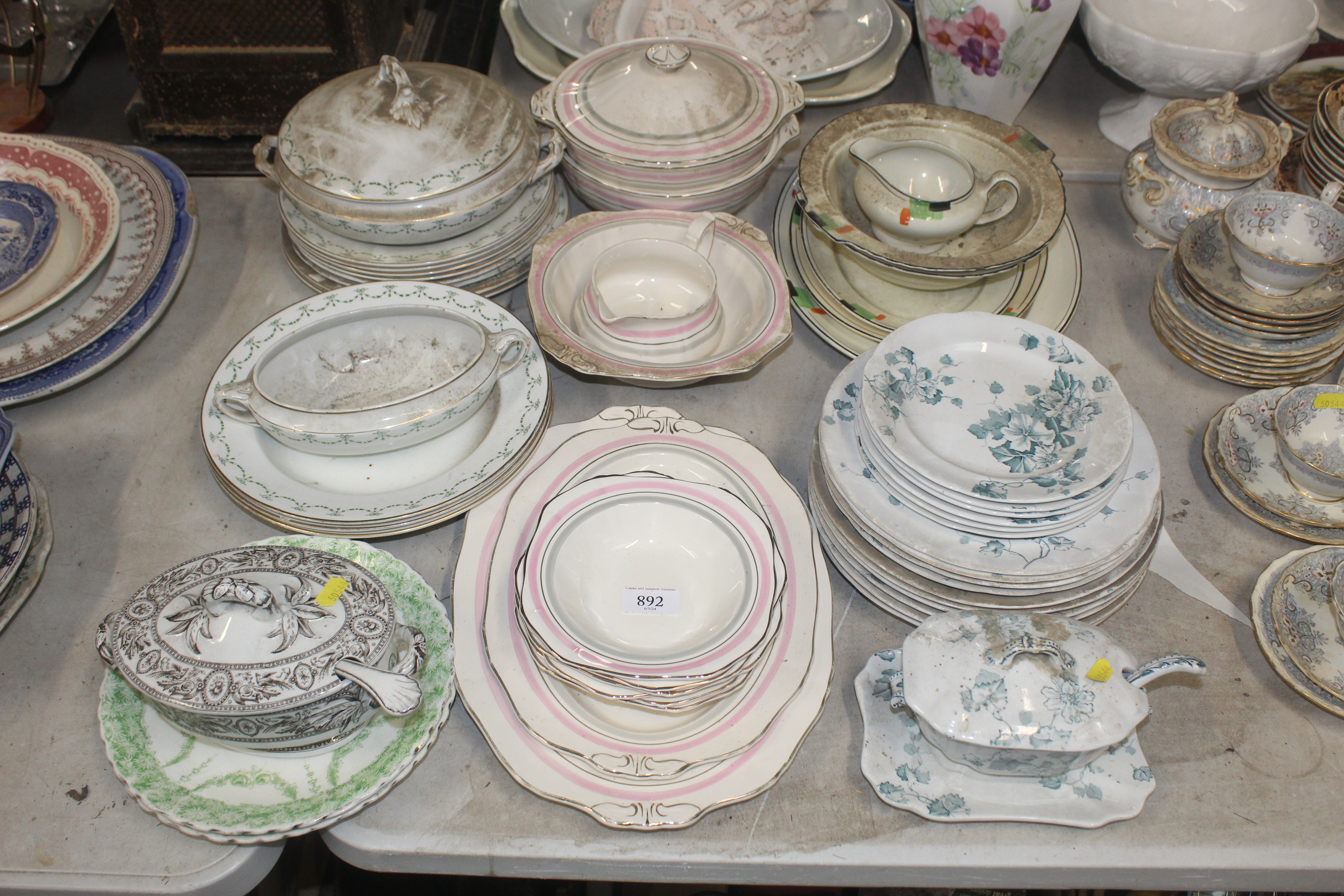 A collection of various patterned dinner ware