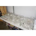 A large collection of various table glassware to i