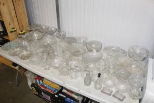 A large collection of various table glassware to i