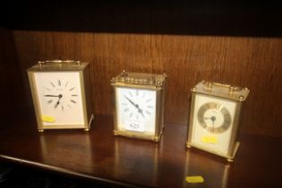 Three carriage style clocks