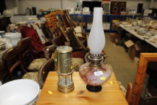 A brass miners lamp and an Art Glass oil lamp