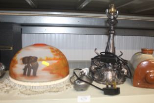 A table lamp and shade decorated with elephants