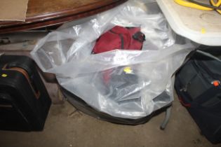 A bag containing various holdalls, bags etc.