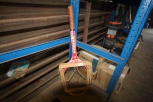 A vintage Dunlop Red Diamond tennis racket with cl