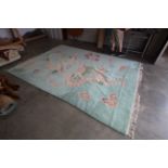 An approx. 12'7" x 9' Chinese style patterned rug