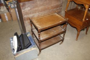 An oak three tier tea trolley