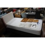 A single divan bed and headboard with Silent Night