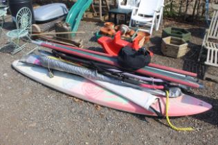 A Bic windsurfing board, four masts, five steering