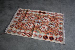 An approx. 4'2" x 2'10" Chobi Kilim rug