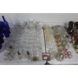 A collection of various table glassware to include