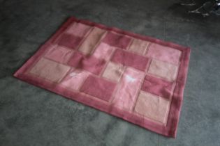 An approx. 5'7" x 4' modern patterned rug AF