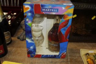 A boxed bottle of Martell cognac and two brandy ba