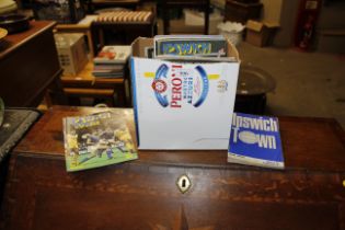 A box of Ipswich Town football programmes