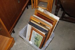 A box of framed and unframed pictures and prints