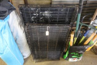 Two metal folding pet cages