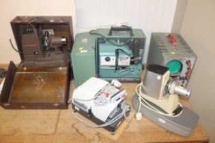 A Bell & Howell 1680 projector, a Braun projector, a Leitz projector and a Telequipment tester and a