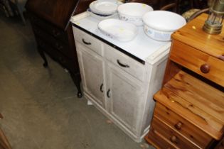 A vintage enamel topped kitchen cabinet