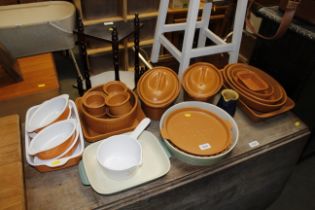 A collection of various pottery casserole dishes a