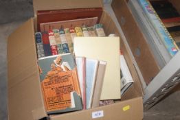 A box of books and Giles annuals