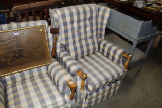 A button back upholstered and wooden framed reclin