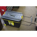 A Stanley plastic pull along mobile tool chest