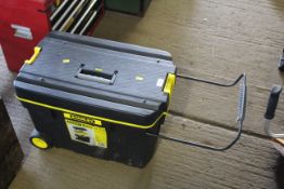 A Stanley plastic pull along mobile tool chest