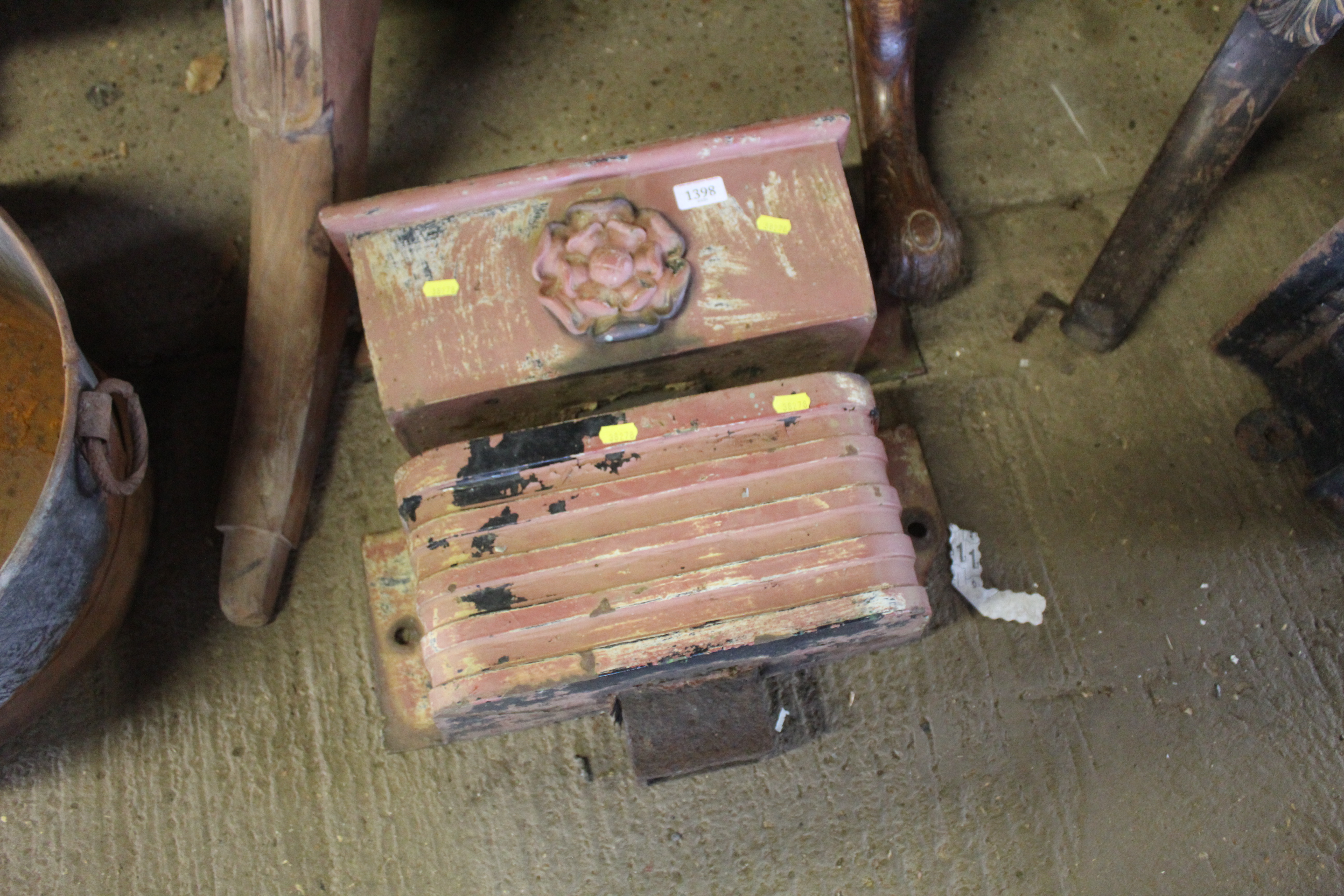 Two painted cast iron rain hoppers, one with flowe