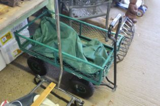 A small four wheeled cargo trolley