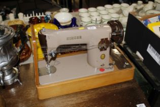 A Singer sewing machine (sold as collectors items)