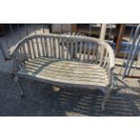 A hardwood two seater garden bench