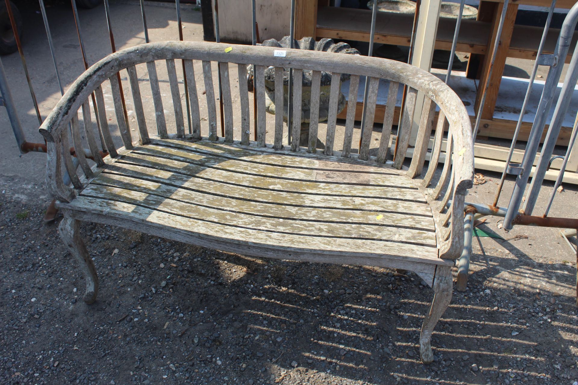 A hardwood two seater garden bench