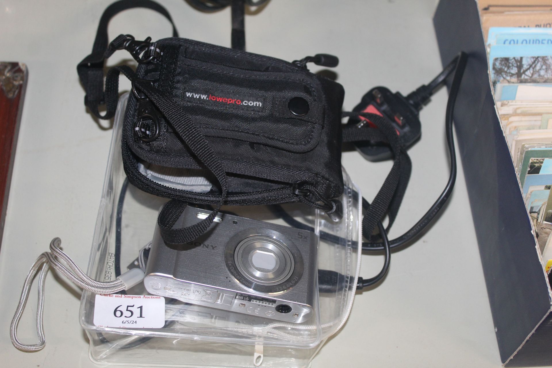 A Sony Cyber Shot digital camera with carrying cas