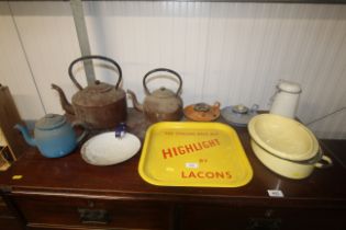 A collection of enamel ware including chamber sticks, kettles and a Pale Ale advertising tray etc